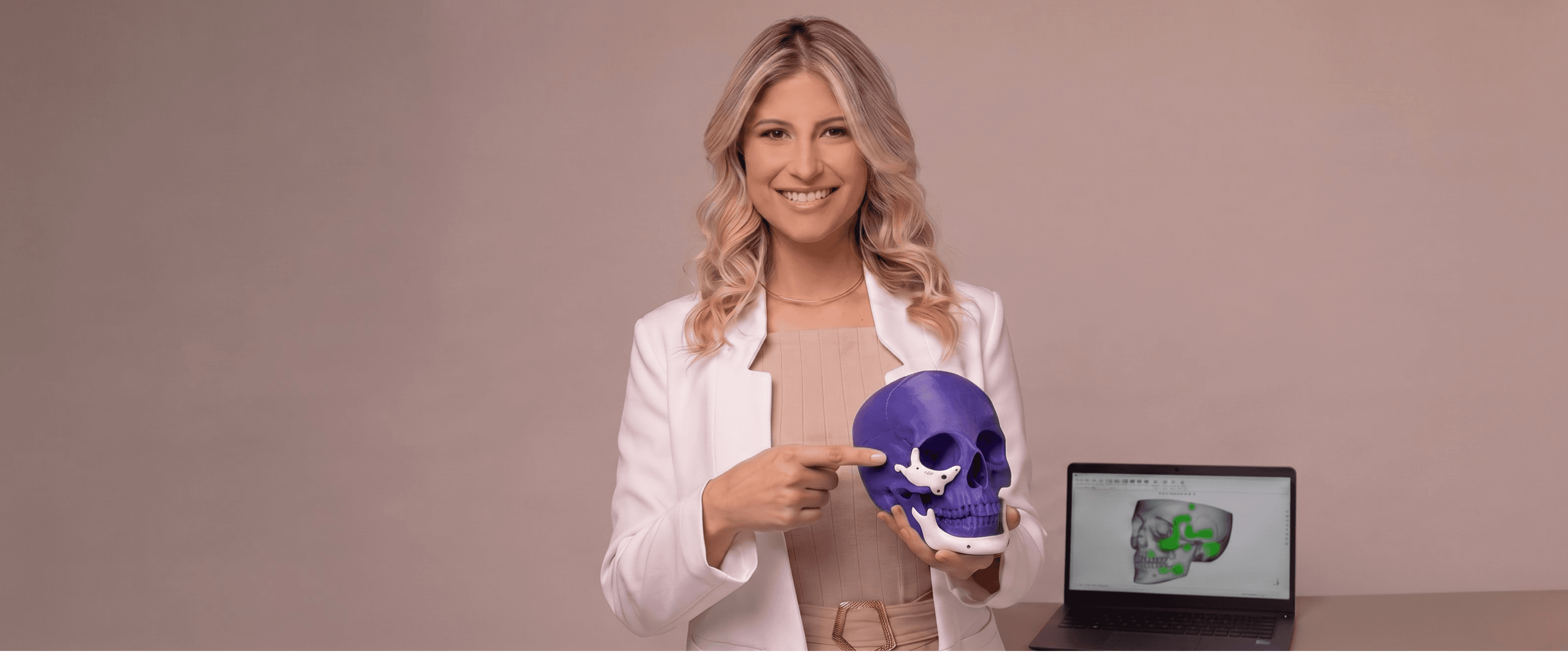 Specialist pointing at the midface implant on the 3D model